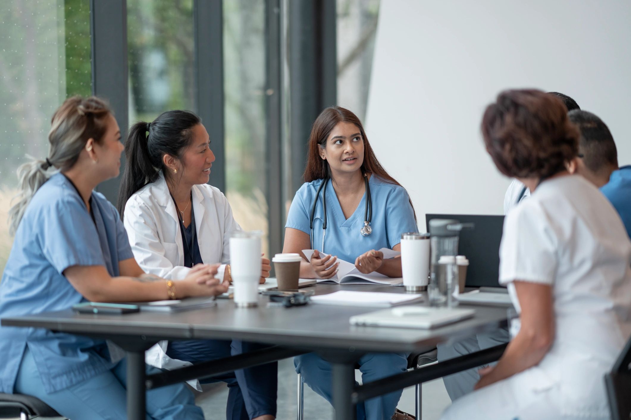 Healthcare professionals collaborating during a team training session